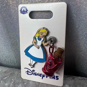 Disney pin Alice in  wonderland holding potion from movie collectable pink blue